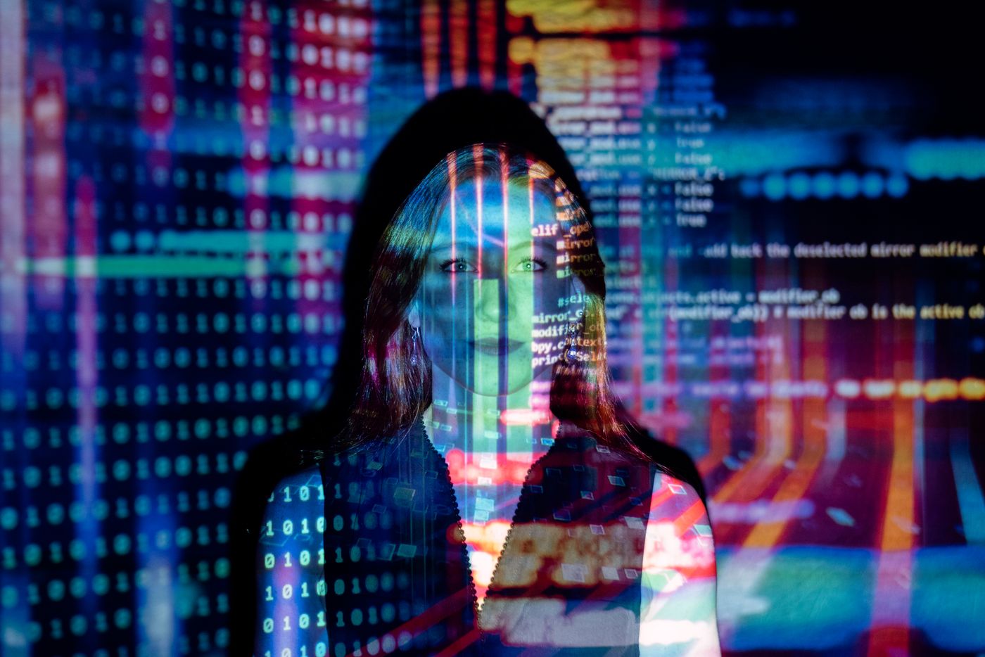 Reach analyst examining channel performance data across dual monitor displays